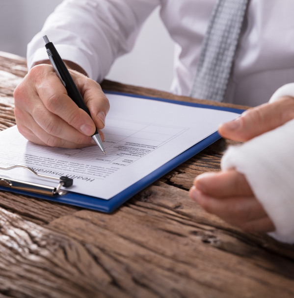 man with plastered hand writes a statement