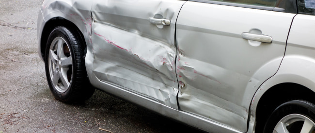 crumpled side of the car after an accident.