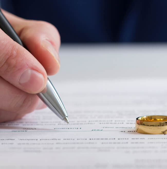 man writes on paper.