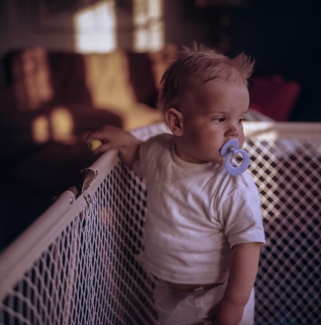 a small child in a crib